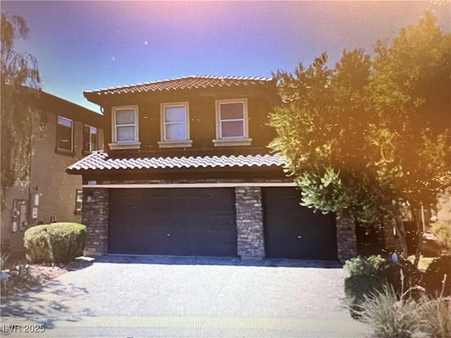 view of front of property with a garage