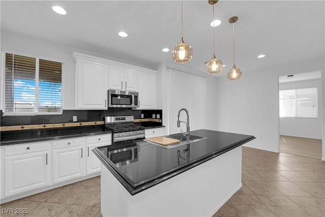 2033 Old Field Ave, North Las Vegas, NV 89081 - kitchen featuring stainless steel appliances, dark countertops, healthy amount of natural light, a sink, and recessed lighting