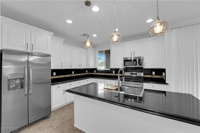 2033 Old Field Ave, North Las Vegas, NV 89081 - kitchen featuring appliances with stainless steel finishes, dark countertops, white cabinets, and recessed lighting