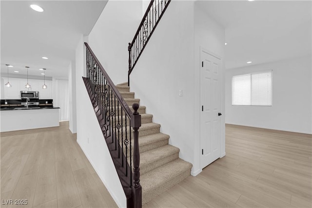 2033 Old Field Ave, North Las Vegas, NV 89081 - staircase featuring wood finished floors and recessed lighting