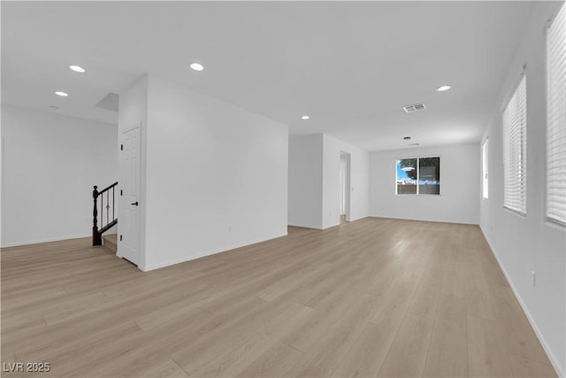 2033 Old Field Ave, North Las Vegas, NV 89081 - empty room with stairs, light wood finished floors, recessed lighting, and baseboards