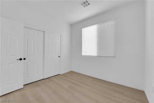 2033 Old Field Ave, North Las Vegas, NV 89081 - unfurnished bedroom featuring light wood finished floors and a closet