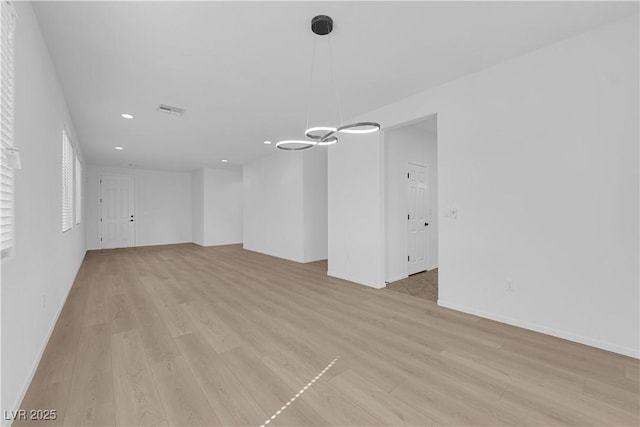 2033 Old Field Ave, North Las Vegas, NV 89081 - unfurnished living room featuring recessed lighting, light wood-type flooring, baseboards, and a chandelier