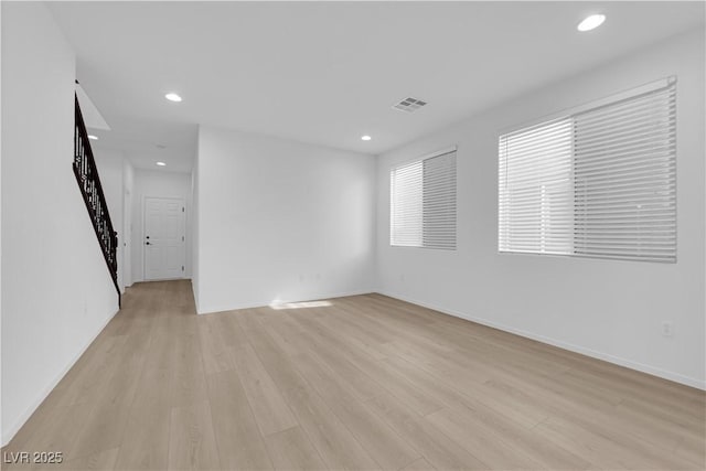 2033 Old Field Ave, North Las Vegas, NV 89081 - unfurnished living room with light wood-style floors, recessed lighting, and baseboards