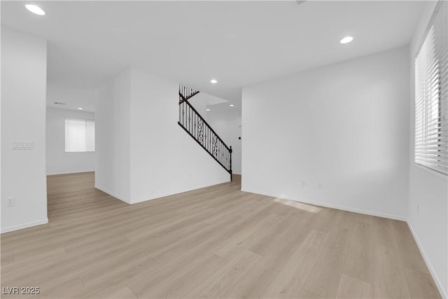 2033 Old Field Ave, North Las Vegas, NV 89081 - unfurnished living room featuring light wood-type flooring, stairway, recessed lighting, and baseboards