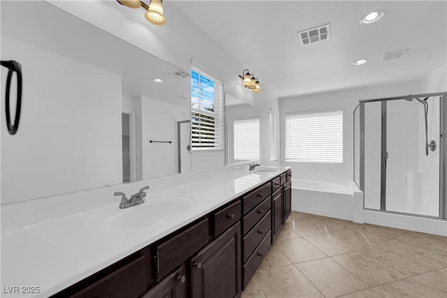 2033 Old Field Ave, North Las Vegas, NV 89081 - bathroom with a shower stall, a garden tub, double vanity, recessed lighting, and tile patterned floors