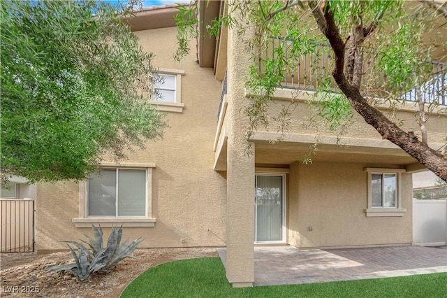 2033 Old Field Ave, North Las Vegas, NV 89081 - rear view of property featuring stucco siding, a patio area, and fence