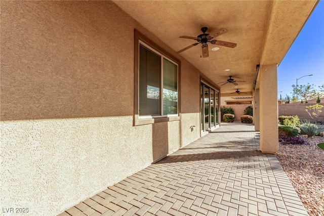 view of patio / terrace featuring ceiling fan