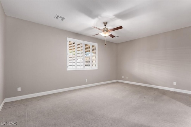 carpeted empty room featuring ceiling fan