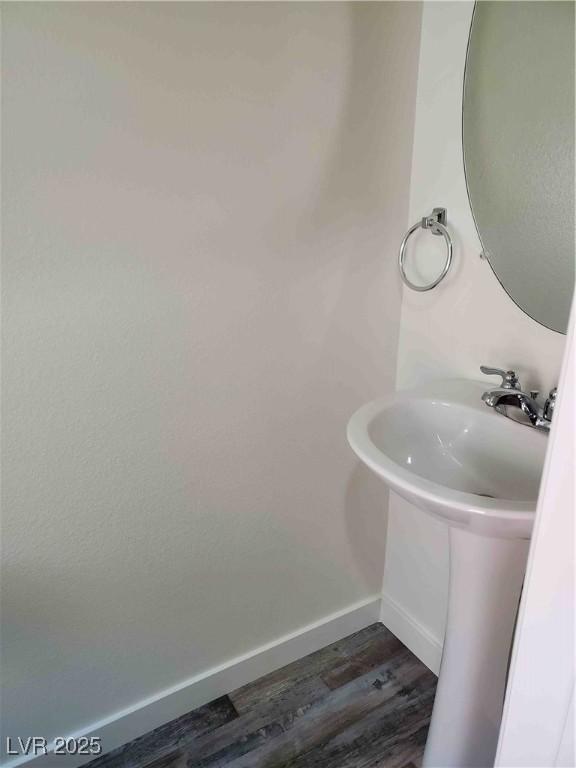 bathroom featuring sink and wood-type flooring