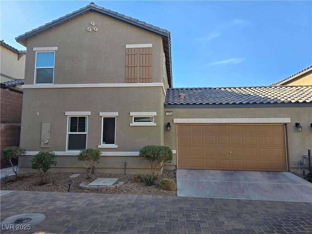 view of front of property with a garage