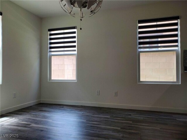 spare room featuring dark hardwood / wood-style flooring