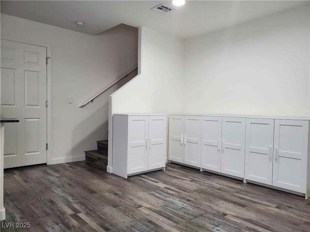 staircase featuring hardwood / wood-style flooring