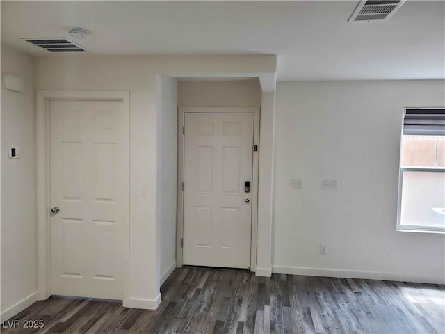 entrance foyer with dark hardwood / wood-style floors