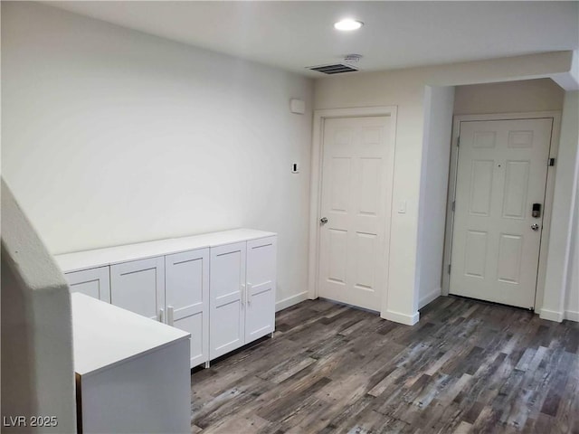 interior space with dark wood-type flooring