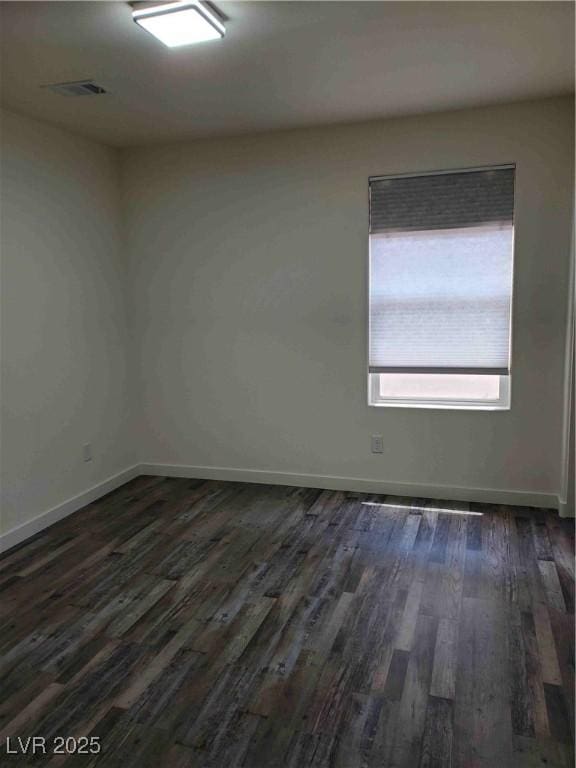 unfurnished room with dark hardwood / wood-style floors