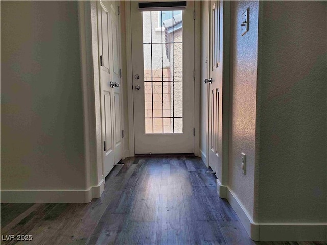 doorway to outside featuring dark hardwood / wood-style floors