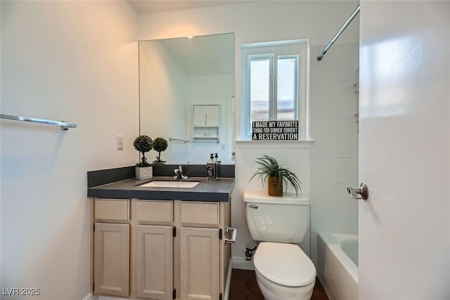 full bathroom featuring shower / bathtub combination, vanity, and toilet