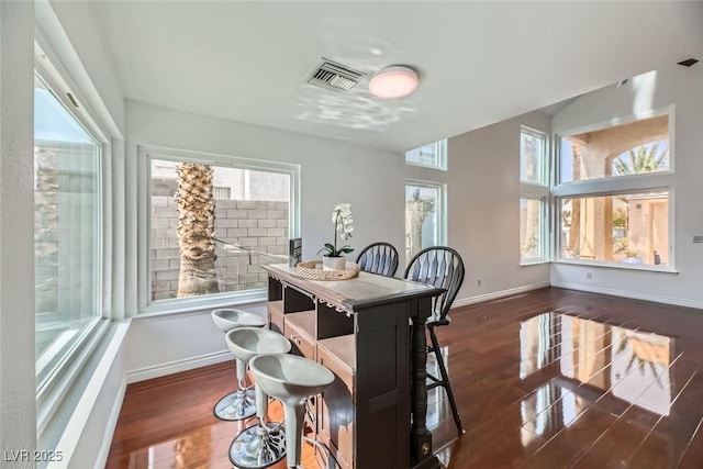 dining area with dark hardwood / wood-style flooring