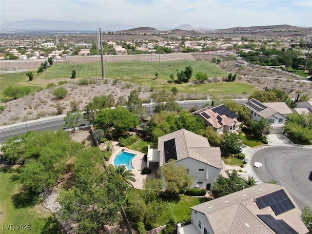 birds eye view of property with a mountain view