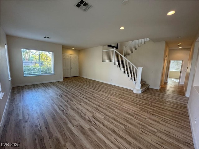 unfurnished living room with hardwood / wood-style floors