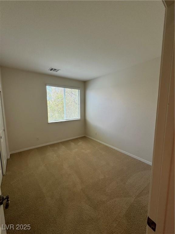 spare room with carpet floors