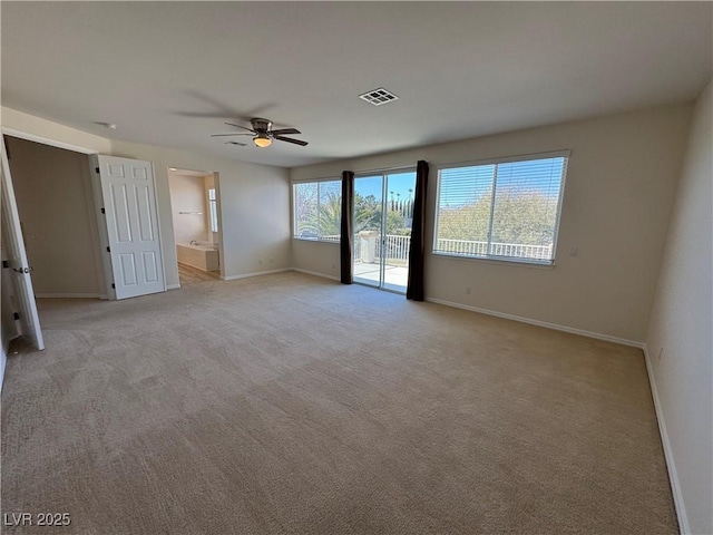 carpeted empty room with ceiling fan