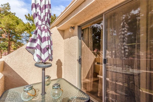 property entrance with stucco siding