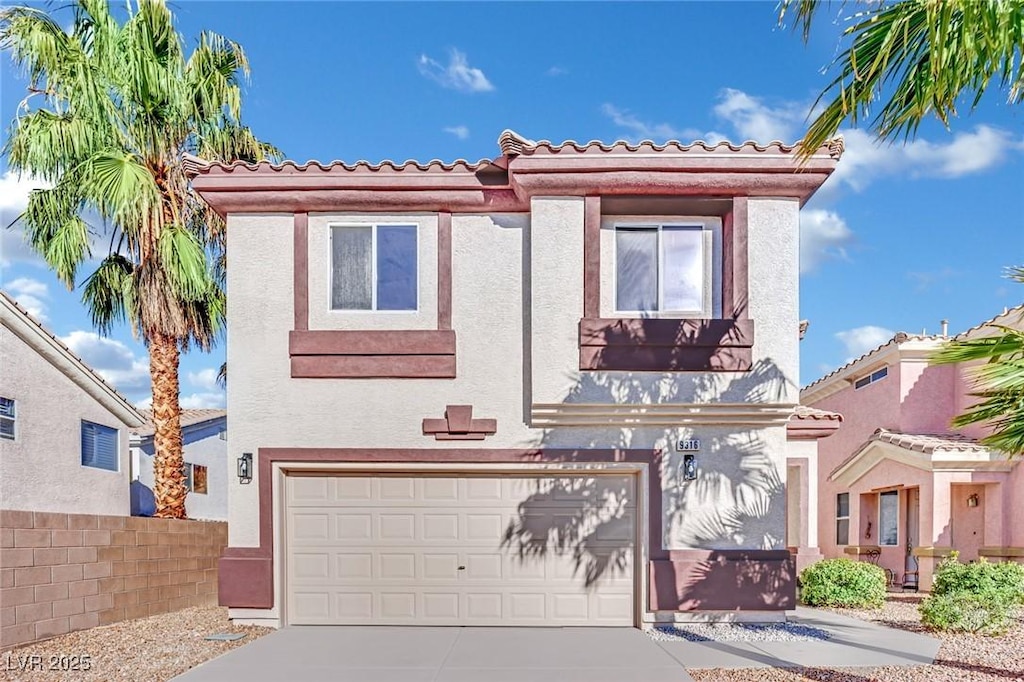 mediterranean / spanish-style home featuring a garage