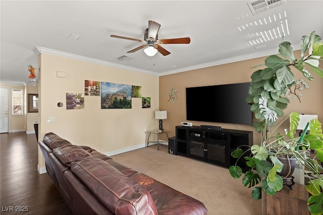 living room with crown molding and ceiling fan