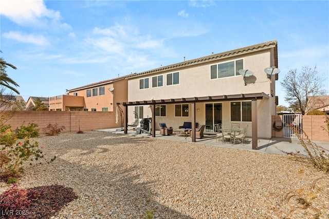 back of property with a patio