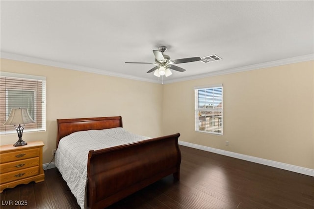 bedroom featuring dark hardwood / wood-style flooring, crown molding, and ceiling fan