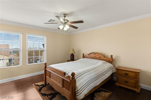 bedroom featuring ornamental molding, dark hardwood / wood-style floors, and ceiling fan