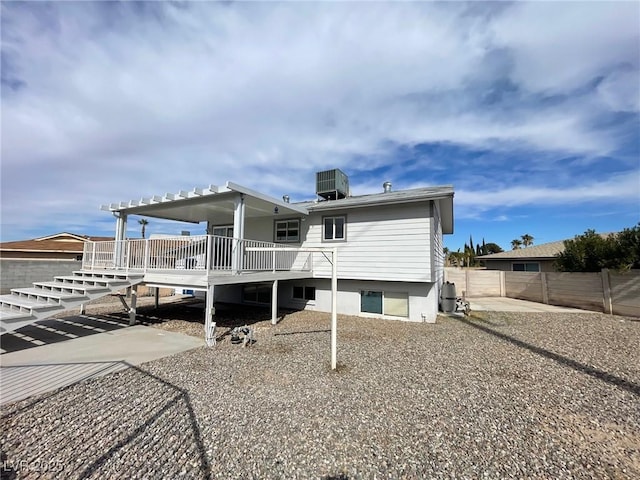 rear view of house with a patio area, central AC, and a deck