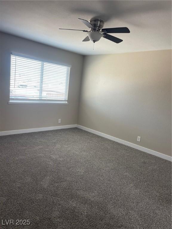 carpeted empty room with ceiling fan