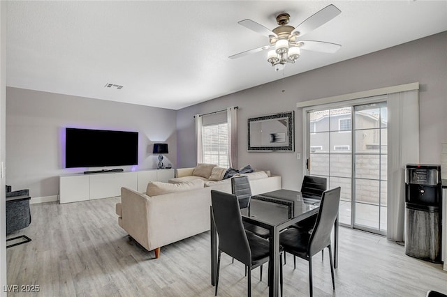 dining room featuring ceiling fan and light wood-type flooring