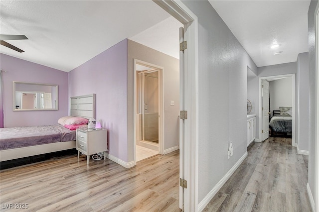 bedroom featuring vaulted ceiling, ceiling fan, and light hardwood / wood-style floors