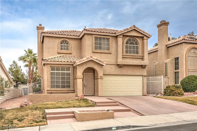 mediterranean / spanish-style house featuring fence, driveway, a chimney, a garage, and a tile roof