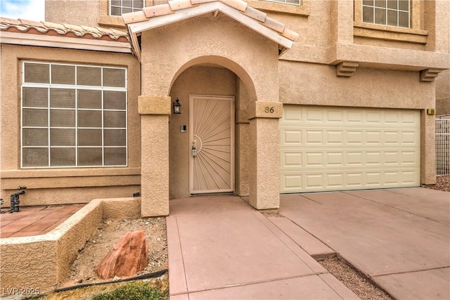 doorway to property featuring a garage