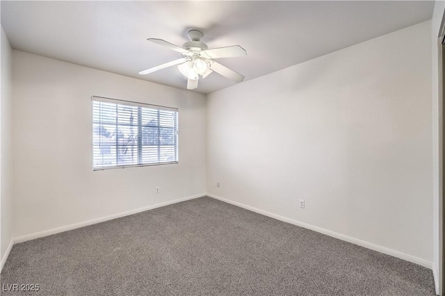 spare room featuring ceiling fan and carpet floors