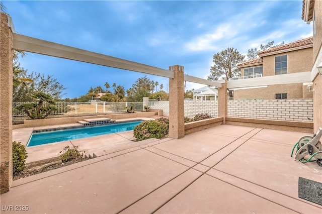 view of swimming pool featuring a patio area