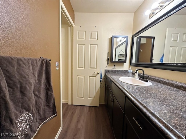 bathroom featuring wood-type flooring and vanity