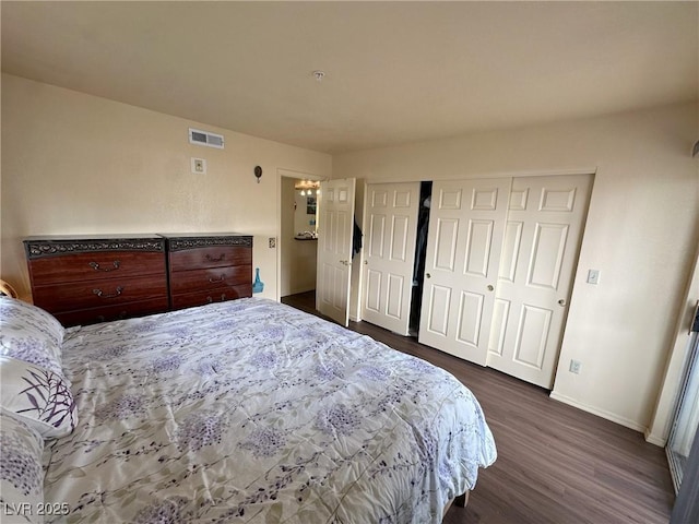 bedroom featuring dark hardwood / wood-style flooring