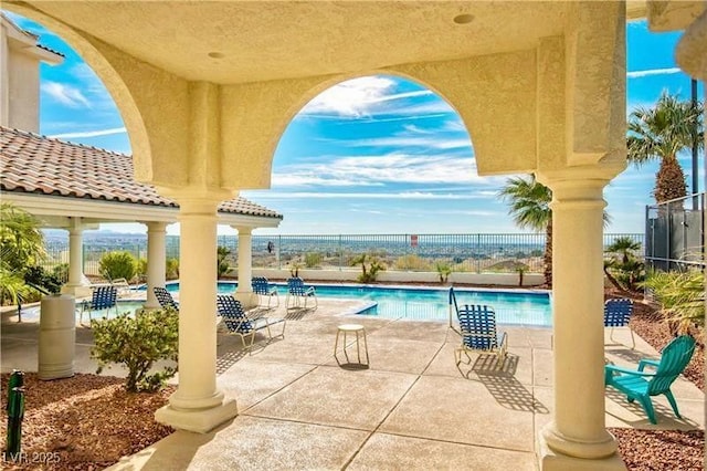 view of patio / terrace featuring a community pool