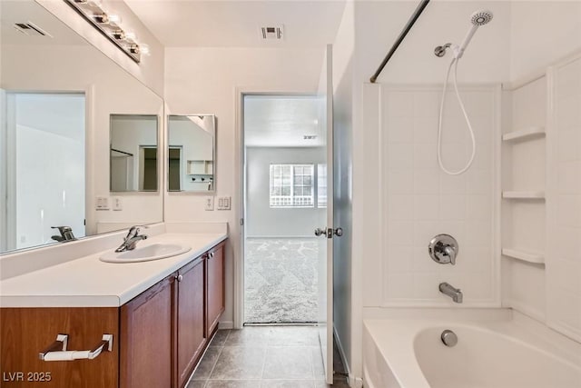 bathroom with vanity, tile patterned floors, and shower / bathing tub combination