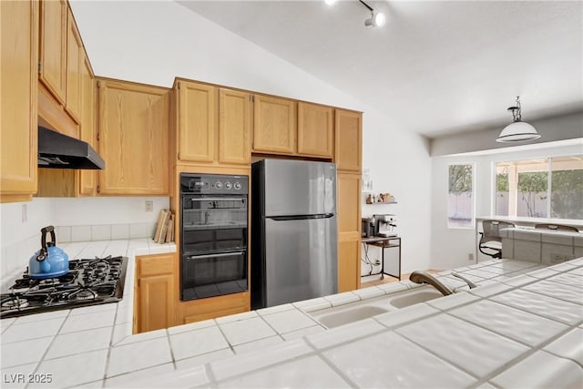 kitchen with tile countertops, sink, stainless steel fridge, black double oven, and gas cooktop