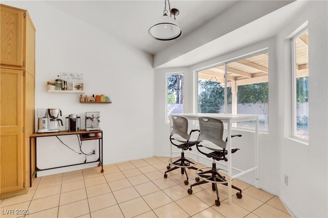 tiled office featuring lofted ceiling