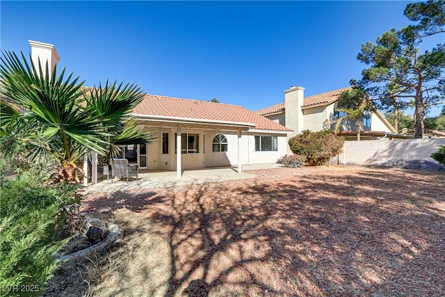 back of property featuring a patio area