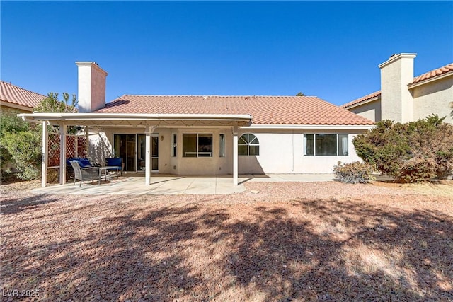 rear view of property with a patio