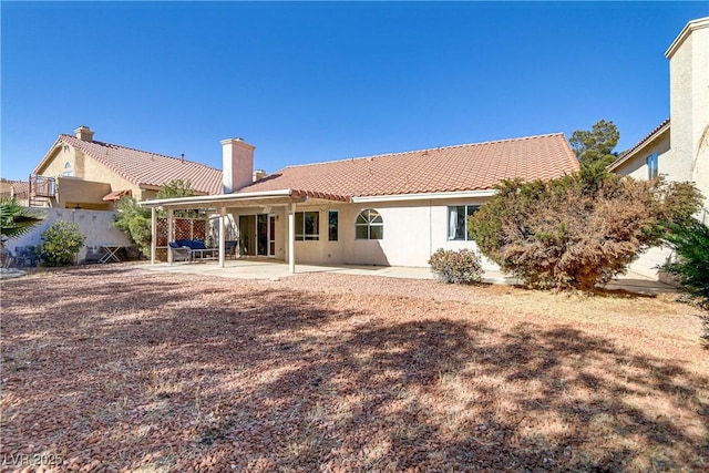 rear view of house featuring a patio area